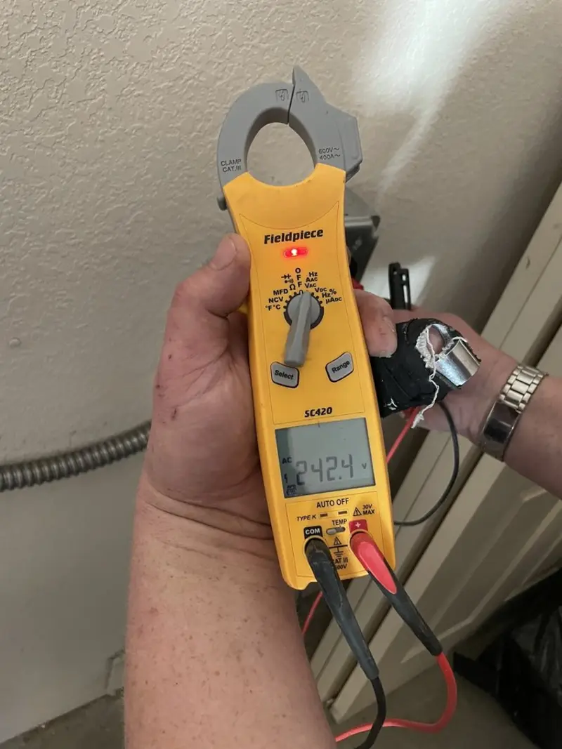 Voltage testing with clamp meter during Aluminum Wiring Replacement in Maize